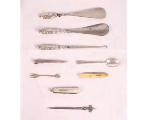 Two silver handled shoe horns, a similar button hook, a silver and mother-of-pearl fruit knife and other items
