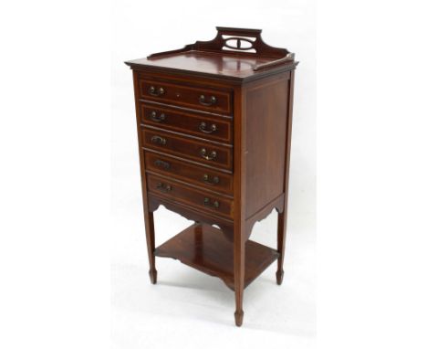 Edwardian mahogany inlaid music chest, with five satin inlaid drop-front drawers over a single open shelf, upon square taperi