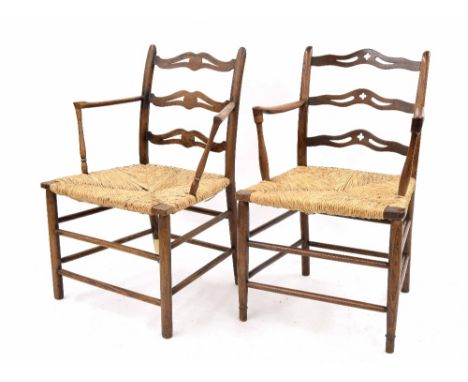 Matched pair of 19th century rush seat ladder back open armchairs, with horizontal pierced splats over rush seats and plain c