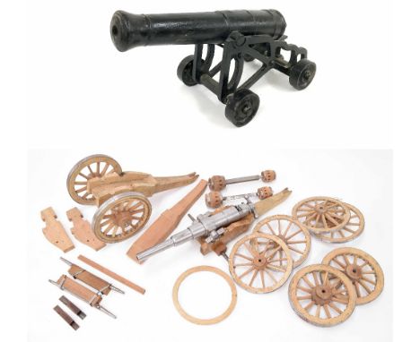 Assorted components for scale model cannon building including eight wooden spoked wheels, 10" diameter approx, pair of axles,