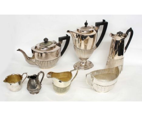 Collection of antique fluted silver plated table ware, including coffee pot, teapot, hot water jug, sugar basin and cream jug