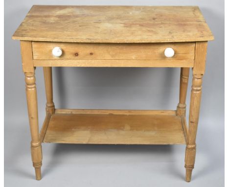 A Stripped Pine Side Table With Single Drawer and Stretcher Shelf 