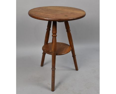 An Edwardian Circular Topped Tripod Table With Stretcher Shelf, 45cms Diameter and 60ms High 