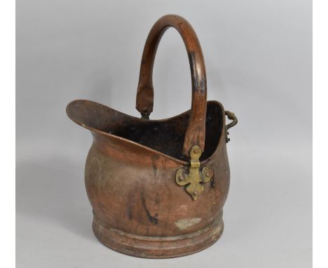 A Vintage Copper Helmet Shelped Coal Scuttle, 43cm high 