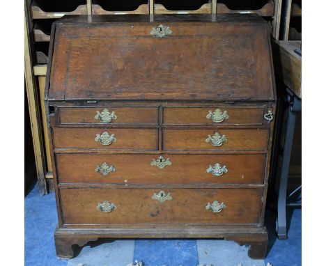 A George III Crossbanded Oak Fall Front Bureau with Fitted Interior and Well, Secret Compartments, Pigeon Holes and Drawers, 
