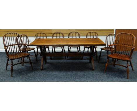 A GOOD ARTS & CRAFTS REFECTORY TABLE of joined oak form with X shaped supports and long stretcher, 193cms long together with 