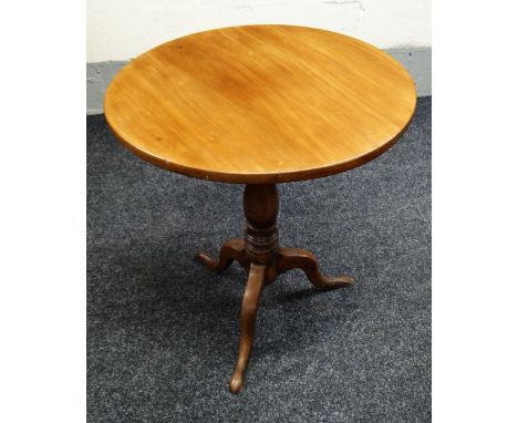 A NINETEENTH CENTURY MAHOGANY TILT-TOP TRIPOD TABLE of plain form on cabriole supports with turned column, 60cms diam