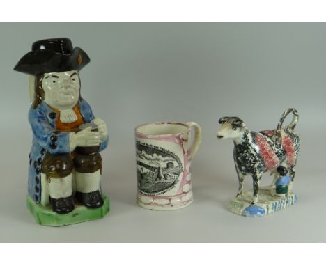 A RALPH WOOD TYPE STAFFORDSHIRE 'OLD TOBY PHILPOT' JUG with Toby seated with beer mug on knee and in light-blue glazed overco