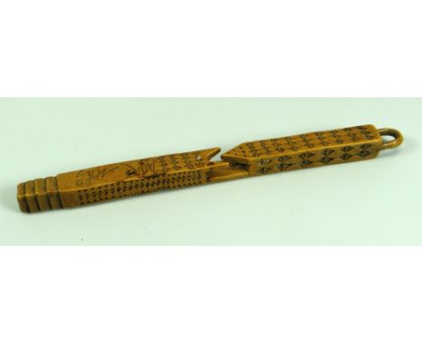 AN EARLY NINETEENTH CENTURY FRUITWOOD CARVED TREEN KNITTING STICK with primitive chiselling and scratched with 'M E May 02' a