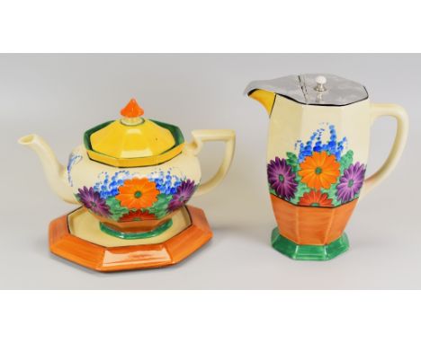 A CLARICE CLIFF 'GAY DAY TRIO' from the Bizarre series and composed of teapot, stand & jug