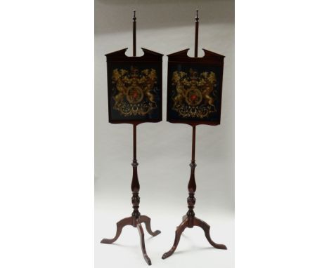 A PAIR OF POLE SCREENS with adjustable panels on long tripod pole supports, both panels with tapestry British ensigns on blue