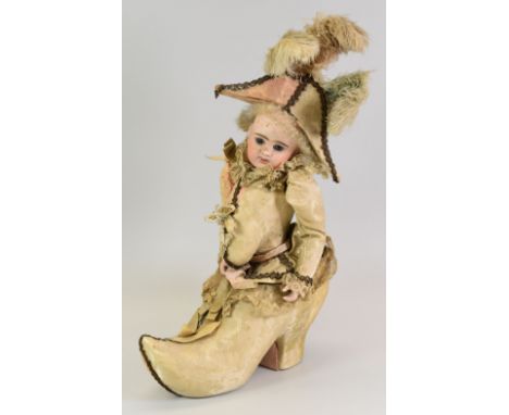 A RARE & VERY UNUSUAL ETIENNER DENAMUR DOLL CHOCOLATE BOX, circa 1860, the doll part protruding from the waist out of the top