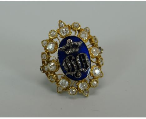 A VICTORIAN CUT DIAMOND & BLUE ENAMEL DRESS RING mounted in yellow gold with an oval leaf design, the enamel with cypher and 