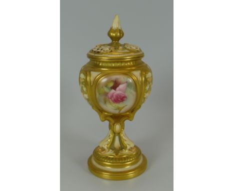 A ROYAL WORCESTER RAISED POT-POURRI of lobed form with elaborate column to the circular foot, painted with three panels of ro