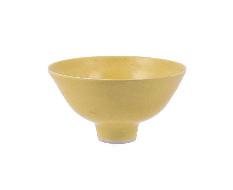λ A Dame Lucie Rie porcelain footed bowl, circa 1975, covered in a yellow glaze, impressed LR seal, 16.5 cm diameterProvenanc