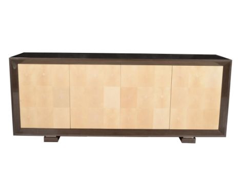 A lacquered Obeche wood and shagreen sideboard, of recent manufacture, the doors enclosing slides and shelves, 92cm high, 230