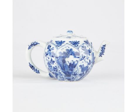 Kangxi period Chinese export porcelain teapot with blue and white decoration within lotus petal forms. Marked along the under