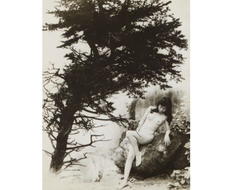 Chin San Long (Lang Jingshan) (Chinese, 1892-1995). Photograph depicting a nude woman reclining against a boulder in a wooded