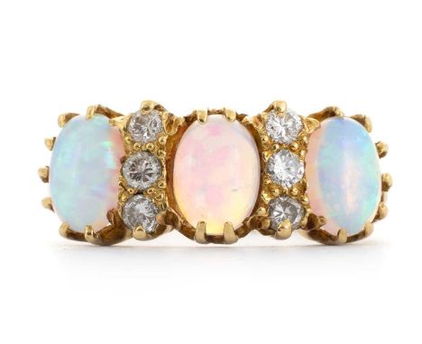 OPAL AND DIAMOND DRESS RING,  set with three oval opals spaced by six diamonds, in eighteen carat gold, size M  4.47g  No dat