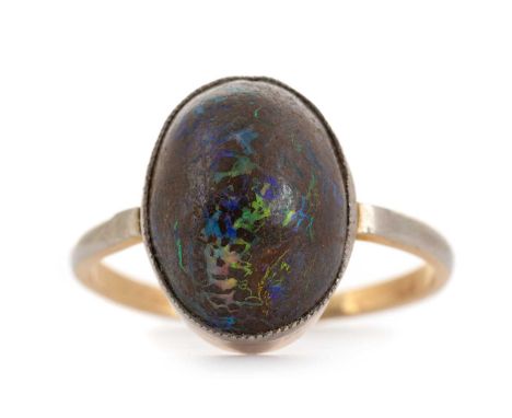 OPAL DRESS RING, the cabochon oval stone set in white goldQty: 3.34g
