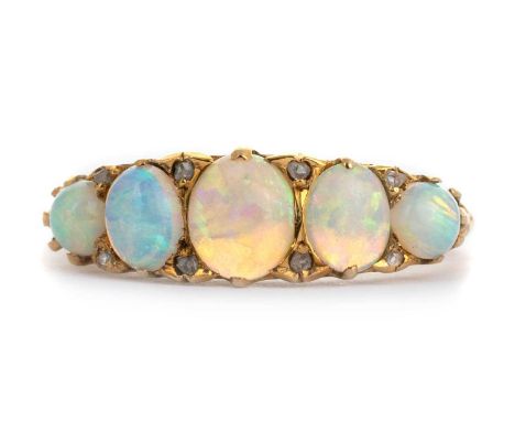 OPAL AND DIAMOND RING, set with cabochon opals interspaced by diamond chips, indistinctly marked, size QQty: 4.5g