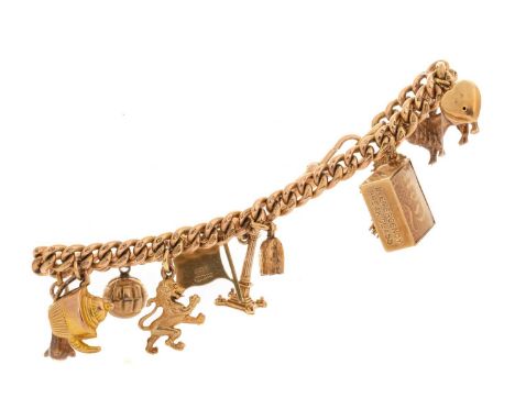 NINE CARAT GOLD CHARM BRACELET. with charms including a lion rampant, teapot and ten shilling note, most marked for nine cara