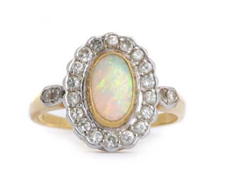 OPAL AND DIAMOND CLUSTER RING, set with an elongated oval opal within a halo of round brilliant cut diamonds, in eighteen car