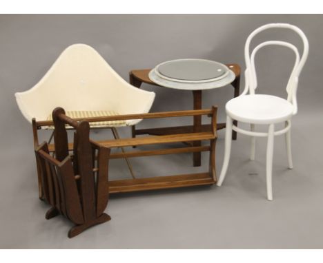 Two chairs, a hanging wall shelf, a small table, a circular mirror and a stick stand. The table 70 cm wide.