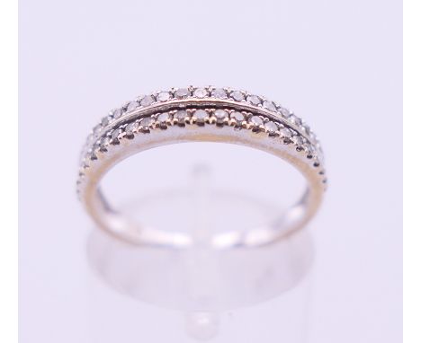 An 18 K white gold and diamond two-row ring. Ring size M. 