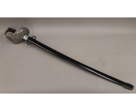 A cavalry sword and scabbard. 105 cm long.