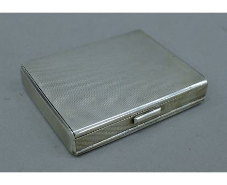 A silver double compartment snuff/pill box. 8 cm wide. 160.9 grammes.