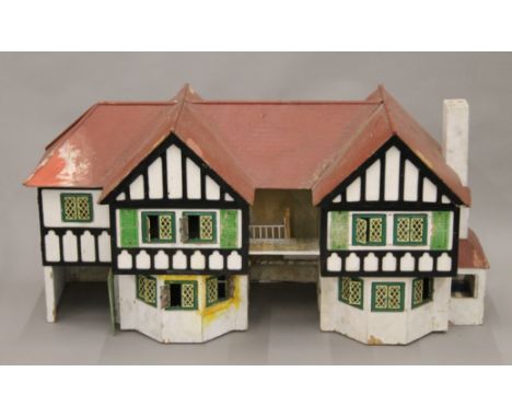 A vintage Tri-ang dolls house. 120 cm long.