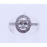 An 18 ct white gold and diamond ring. The central stone spreading to approximately 0.5 carat.