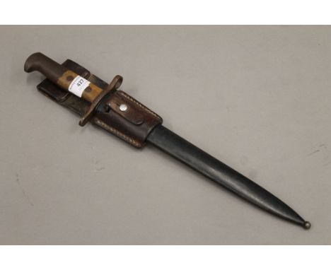 A German military interest bayonet with scabbard and leather frog by Elsener Schwyz. 44.5 cm long.