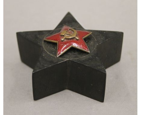 An enamel Soviet badge on a wooden plinth. 6.5 cm wide overall.