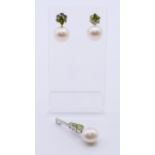 A cultured pearl, peridot and diamond pendant and matching earrings,