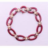 A Russian silver and white and cherry red guilloche enamel bracelet,