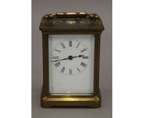 A brass carriage clock. 14 cm high. 