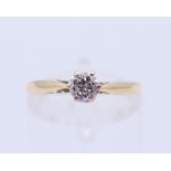 An 18 ct gold diamond solitaire ring. Ring size N.