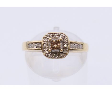 A 9 K gold diamond set ring. Ring size L.