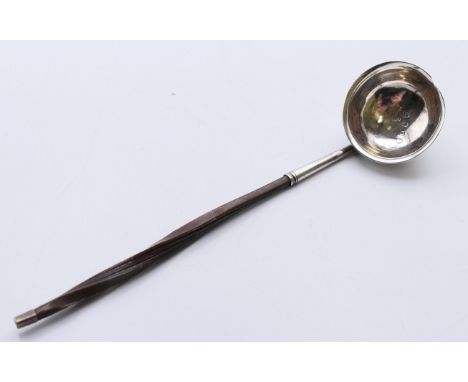 A baleen handled silver toddy ladle, hallmarked for London 1799. 18 cm long.