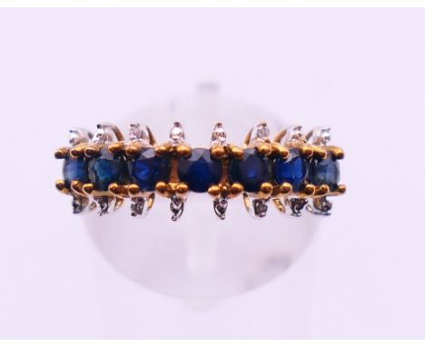 A 9 K gold sapphire ring. Ring size N. 