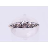 An unmarked gold five-stone diamond ring. Ring size P/Q.