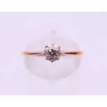 An 18 ct gold diamond solitaire ring. Ring size N.