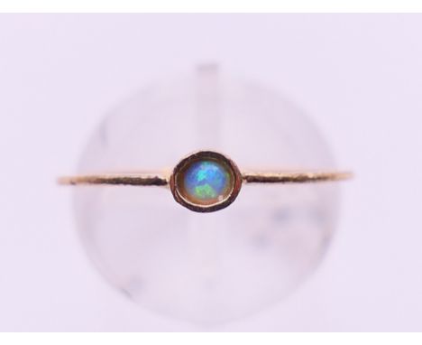 A 9 ct gold and opal ring. Ring size M/N. 