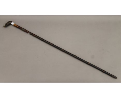 A Victorian sword stick with horn dog's head handle. 87.5 cm long.