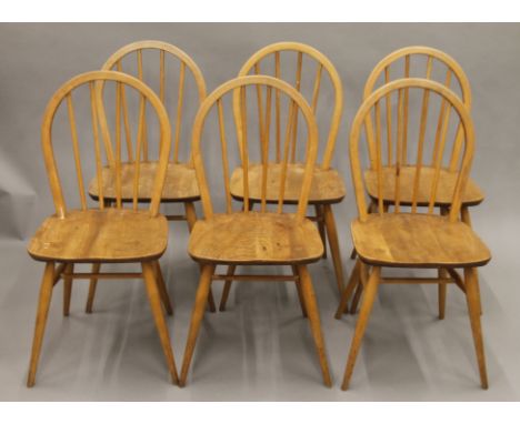 A set of six elm seated Ercol-style kitchen chairs. 39 cm wide.