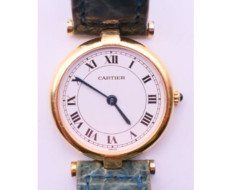 A boxed 18 K gold ladies' Cartier wristwatch. 2.5 cm wide.