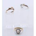 Two 9 ct gold pearl and diamond set rings, and an unmarked white gold pearl and diamond ring.