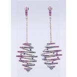 A pair of 18 ct gold sapphire and diamond earrings, each of kite-shaped outline,